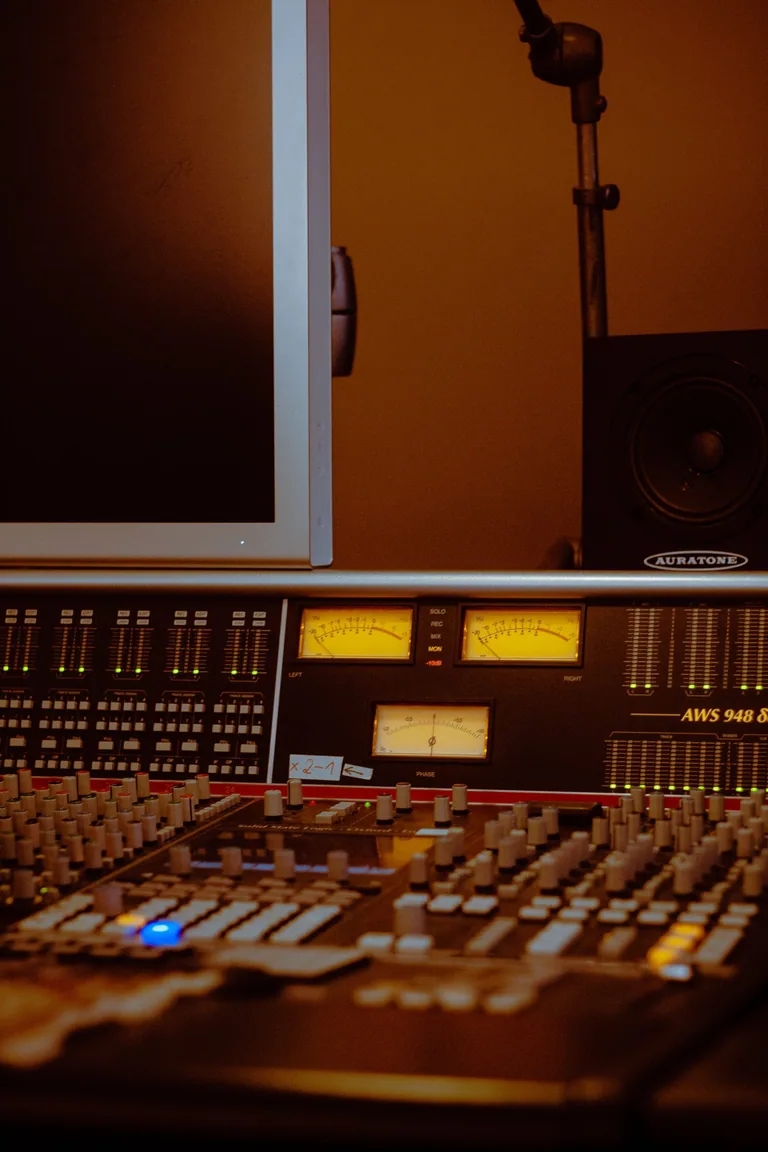 Professional mixing console and studio monitors in Limusic recording studio control room, Limoux, southern France
