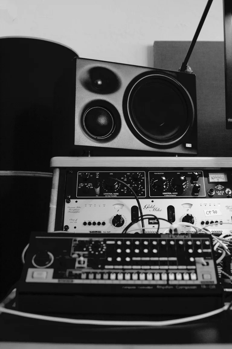 Professional recording studio equipment setup with studio monitors, vintage preamps and drum machine at Limusic residential recording studio in southern France