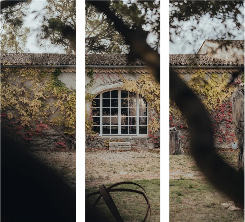 Historic stone building with ivy-covered walls at Limusic artist retreat in southern France
