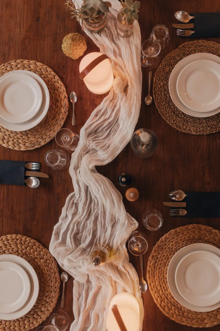 Elegantly styled dining table setup at Limusic residential recording studio in southern France, featuring place settings and rustic wooden table
