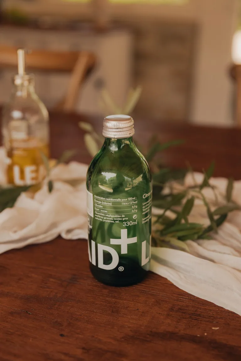 Refreshment bottle on wooden table at Limusic residential recording studio in southern France during recording session break